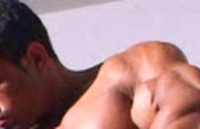 Brazilian bodybuilder Robert Bueno posing naked ina gym